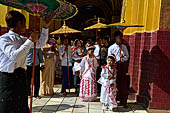 Ear piercing ceremony at Mahamuni Buddha Temple, Myanmar